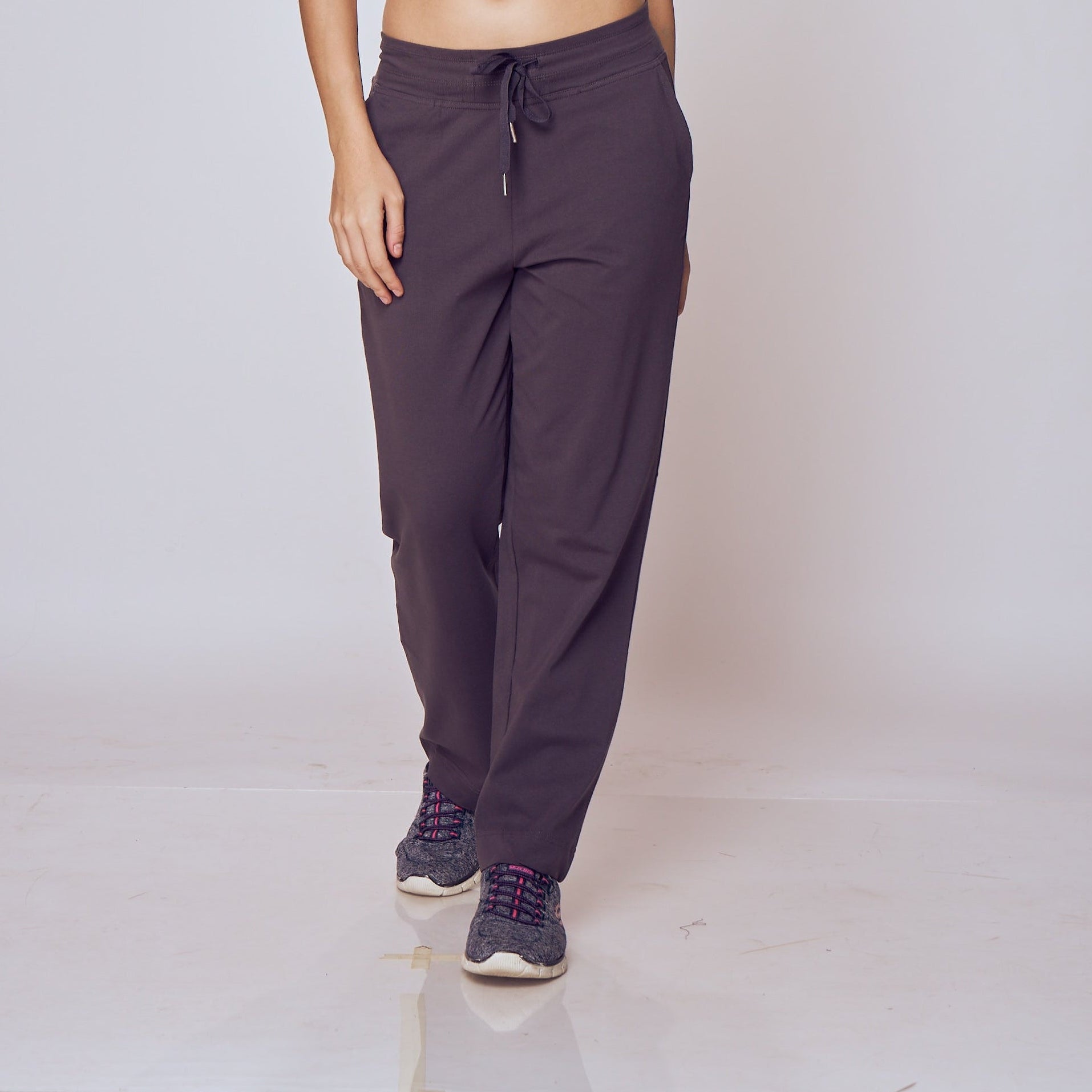 Person wearing dark purple Classic Flex Regular Fit Track Pants on a light background