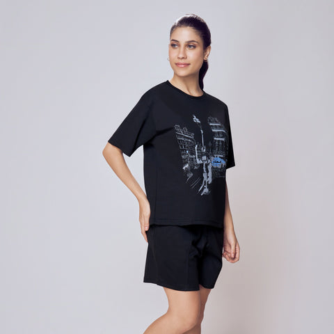 Woman wearing a black t-shirt and shorts set on a white background. Co-ord Set for Women