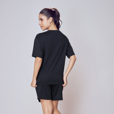 Person wearing a black outfit on a plain background. Co-ord Set for Women