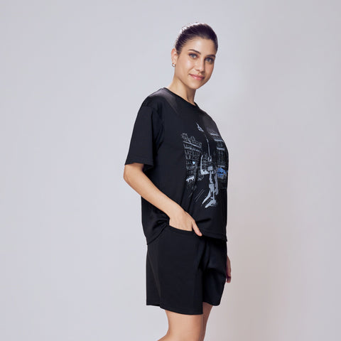 Woman wearing a black t-shirt and shorts set on a white background. Co-ord Set for Women