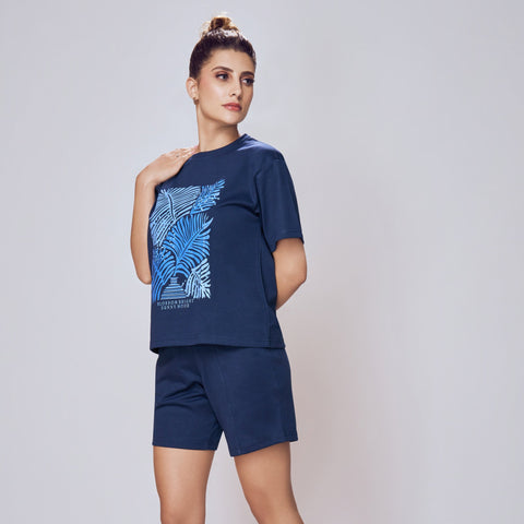 Woman wearing a navy blue Co-ord Set for Women with a blue pattern on a white background