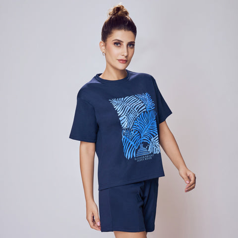 Woman wearing a navy blue t-shirt with a graphic design Co-ord Set for Women on a plain background
