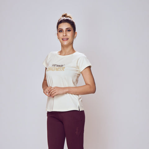 Person wearing a white t-shirt and maroon pants on a plain background