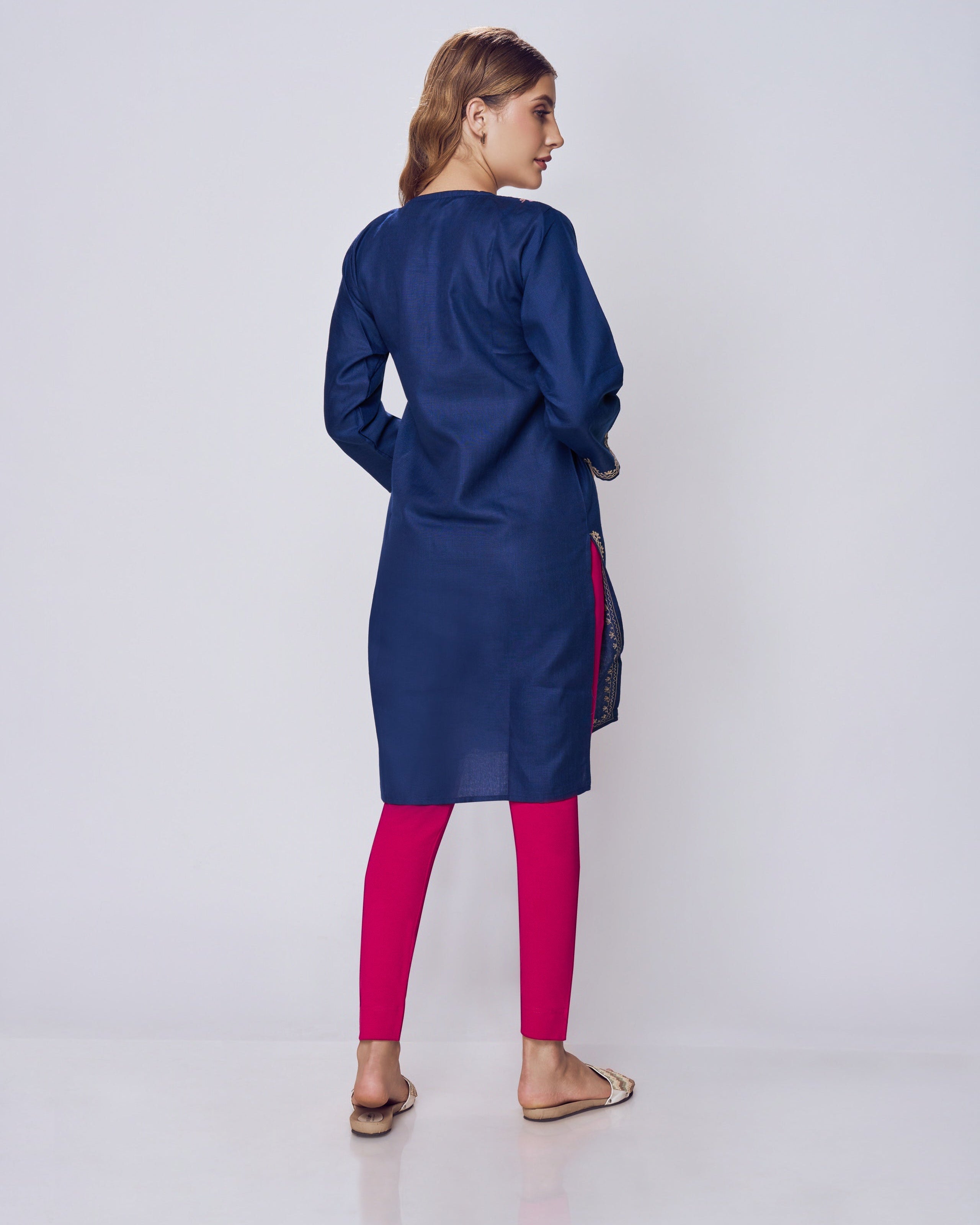 Woman wearing a blue dress with red Kurti Pants Leggings on a white background